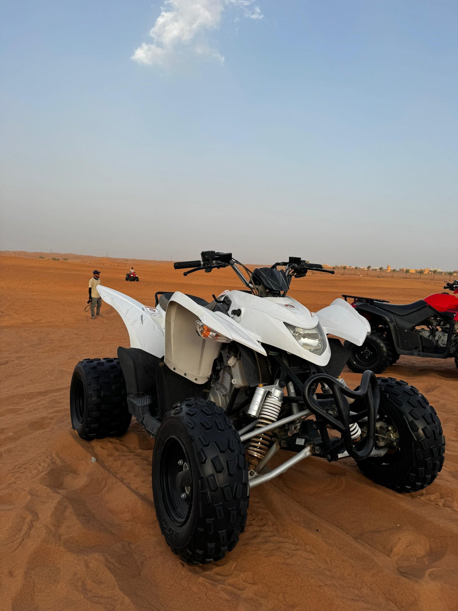 400cc quad bike carving dunes in Dubai desert