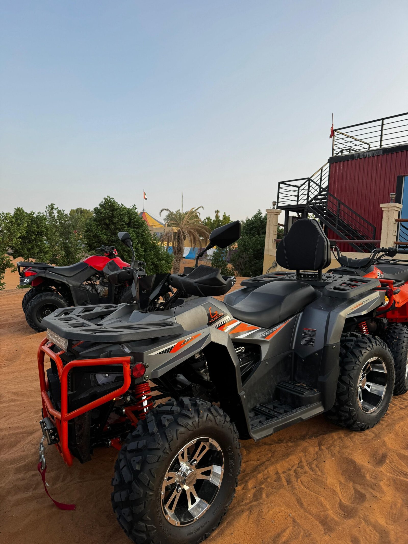 300cc quad bike on the dunes at sunset